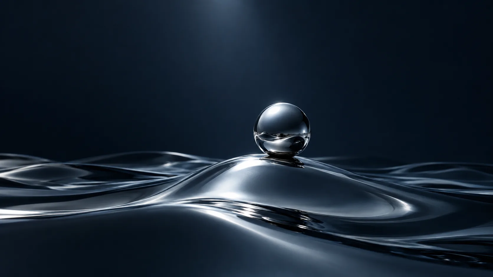 A mirrored chrome sphere resting on rippled liquid-metal dunes under a spotlight